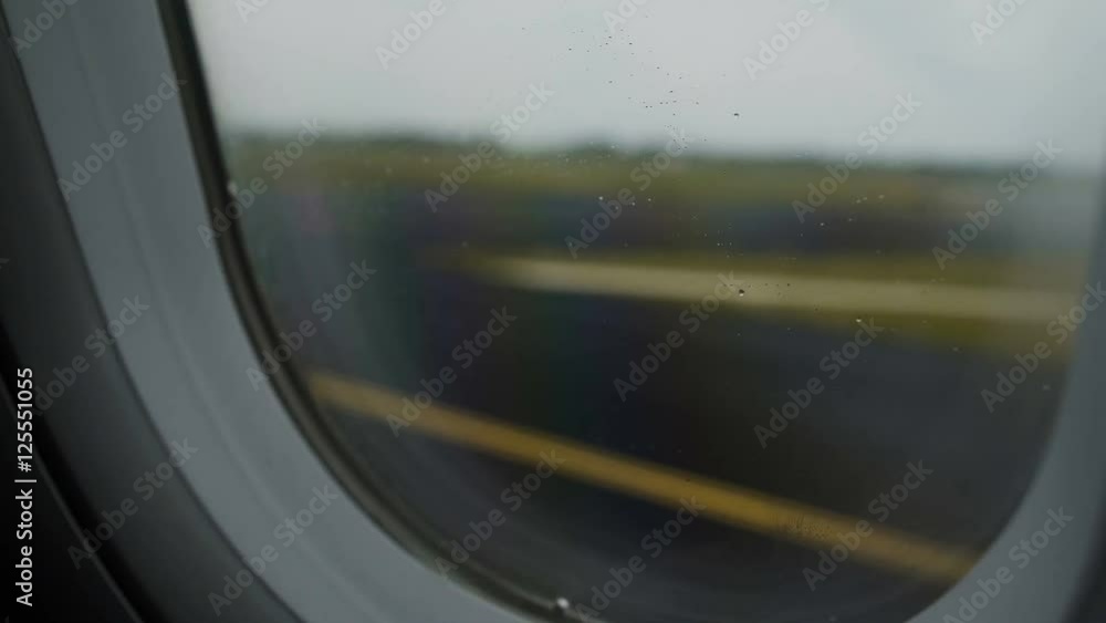 Airplane moving along runway after successful landing at airport, flight phobia Airplane moving along runway after successful landing at airport, flight phobia