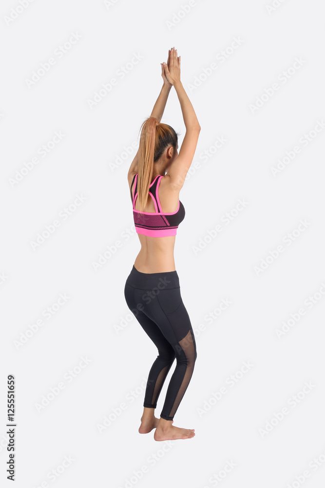 Young woman in yoga pose.