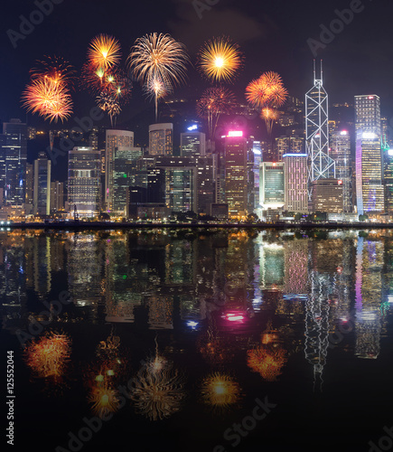 Fireworks Festival over Hong Kong city with water reflection