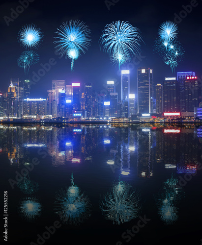 Fireworks Festival over Hong Kong city with water reflection
