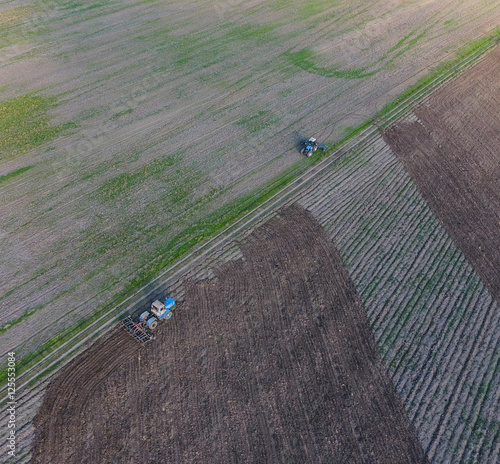Top view of the tractor that plows the field. disking the soil. Soil cultivation after harvest