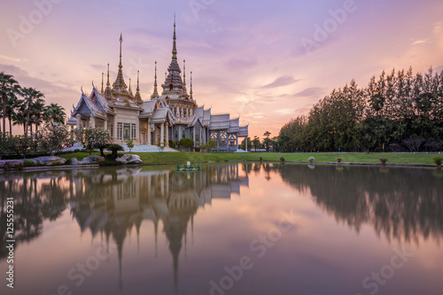 Wat Luang Pho Toh temple with water reflection in twilight time,