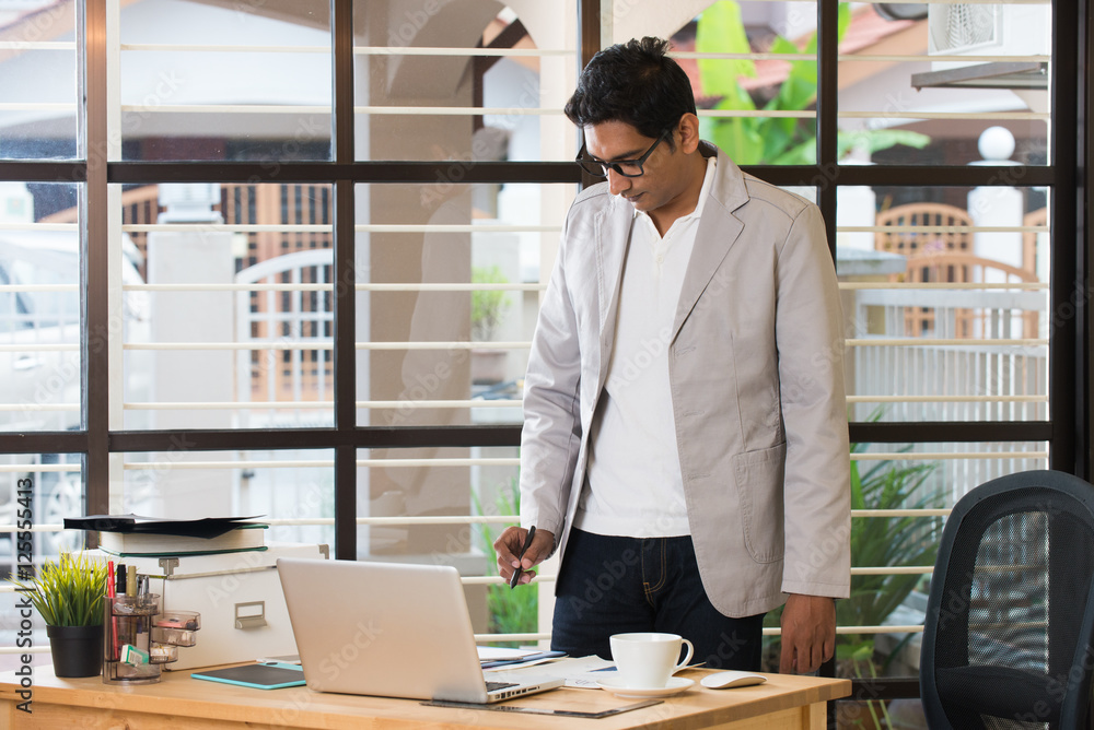 indian male working from office indian male working from office