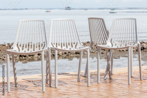 Empty beach chairs and sea beach background. Concept for rest  r