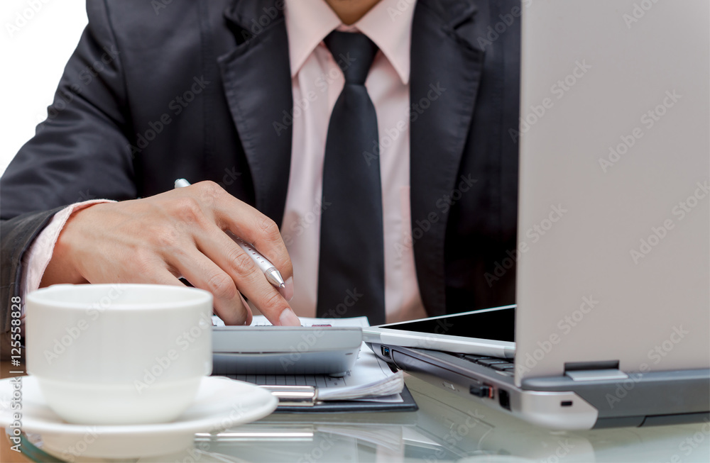 Businessman calculating the information with laptop Businessman calculating the information with laptop