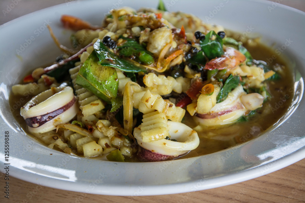 Spicy seafood stir fried, Thai spicy herb food Spicy seafood stir fried, Thai spicy herb food