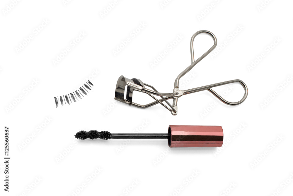 Mascara, fake eyelashes and eyelash curler isolated on white background