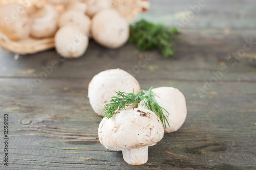 champignon mushrooms on a table, selective focus