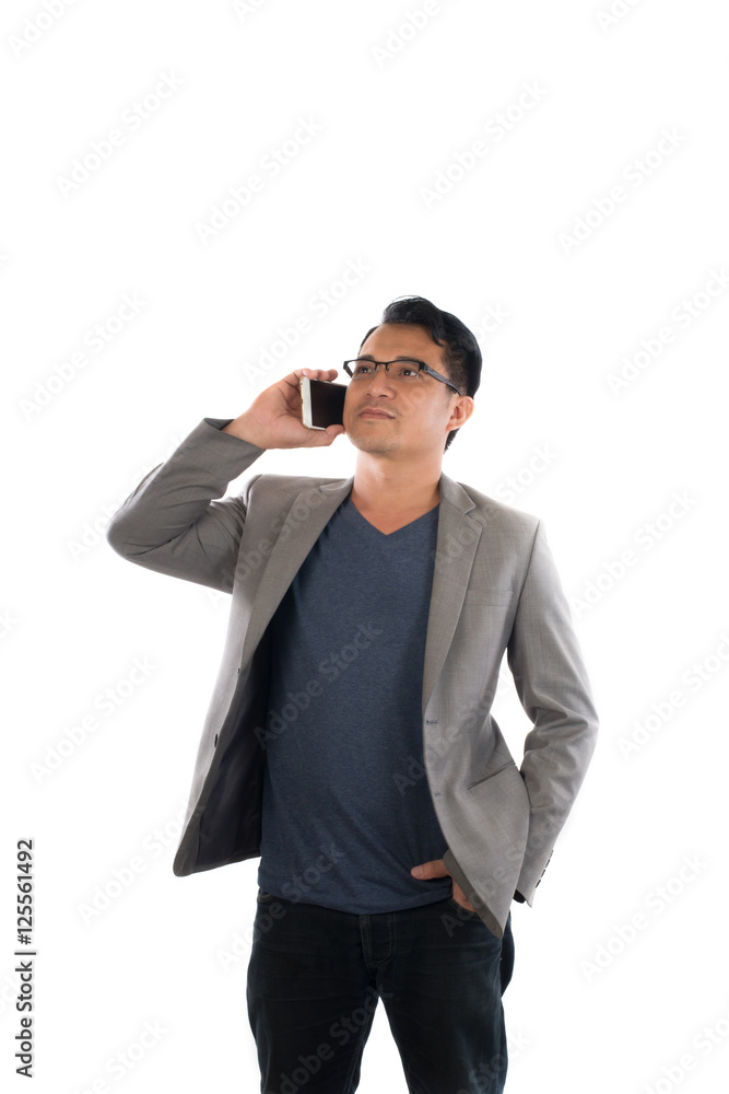 Handsome businessman and glasses standing and talking on mobile Handsome businessman and glasses standing and talking on mobile