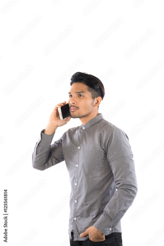 Young hipsterman talking on phone looking away isolated on white Young hipsterman talking on phone looking away isolated on white