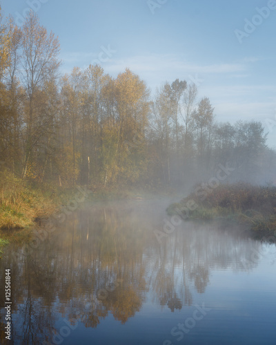 Misty morning on the river. Autumn Canada