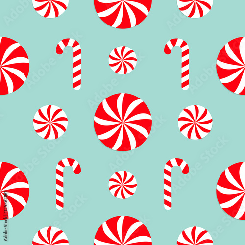 Seamless Pattern Decoration. Christmas Candy Cane Round white and red sweet set. Wrapping paper, textile template. Blue background. Flat design.