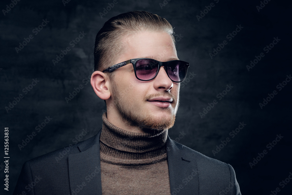 Obraz premium A man in sunglasses in turtle-neck sweate.
