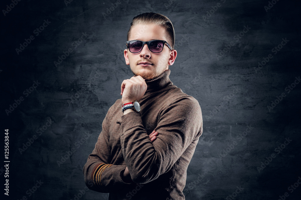 Fototapeta premium A man in sunglasses in turtle-neck sweate.