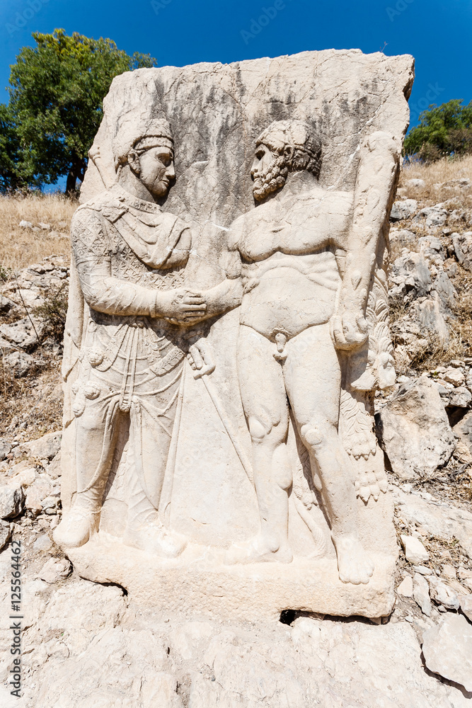 King Mithridates shaking hands with Herakles. King Mithridates shaking hands with Herakles.