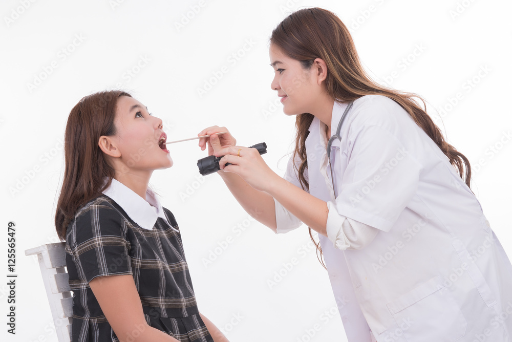 young woman at the physician checking his throat. female doctor