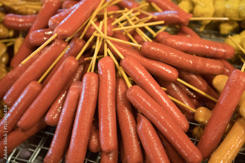 Thai sausages on stick isolated on stove at the the food market Thai sausages on stick isolated on stove at the the food market