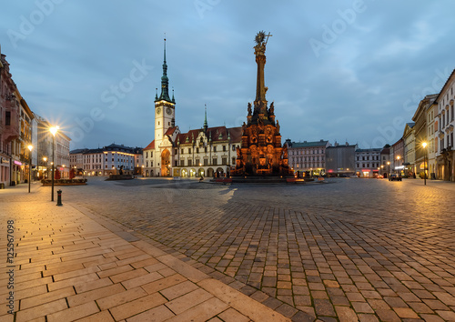Town hall and Holy Trinity Column in Olomouc after sunset.
