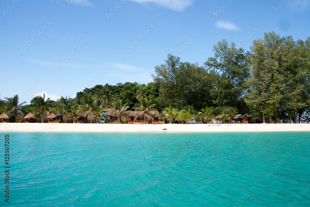 Ko Lipe, Thailand Tourists lay on the pure white sand in front Ko Lipe, Thailand Tourists lay on the pure white sand in front