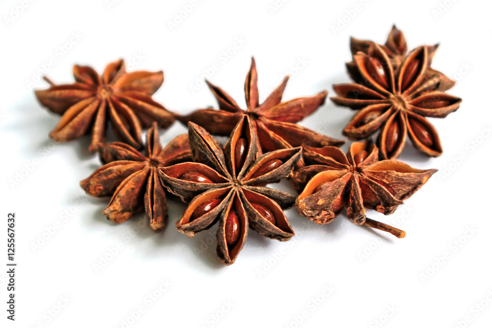 Star anise seeds on a white background