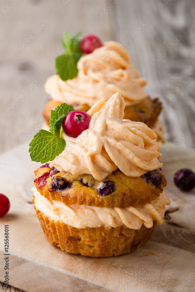 Homemade autumn cranberry pumpkin cupcakes with cream cheese Homemade autumn cranberry pumpkin cupcakes with cream cheese