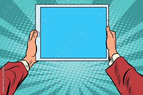 Pop art electronic tablet in the hands