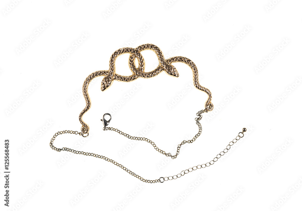 gold necklace in the form of a snake close-up isolated on white background gold necklace in the form of a snake close-up isolated on white background