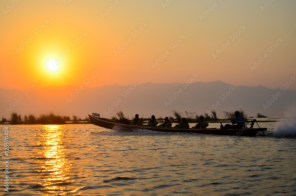Boat in the bay on the background of a bright sunset sky Boat in the bay on the background of a bright sunset sky