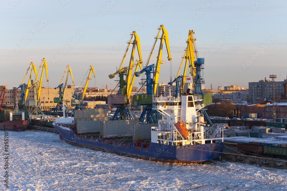 Operation of the auxiliary ships in seaport of St. Petersburg during winter navigation. Russia.