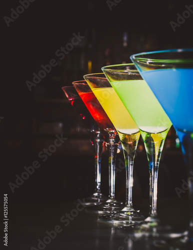 Multicolored cocktails at the bar.