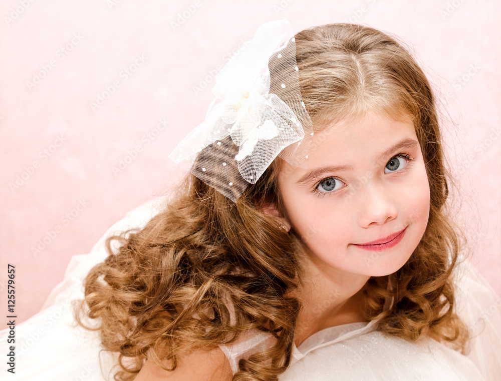 Adorable smiling little girl in white princess dress Adorable smiling little girl in white princess dress