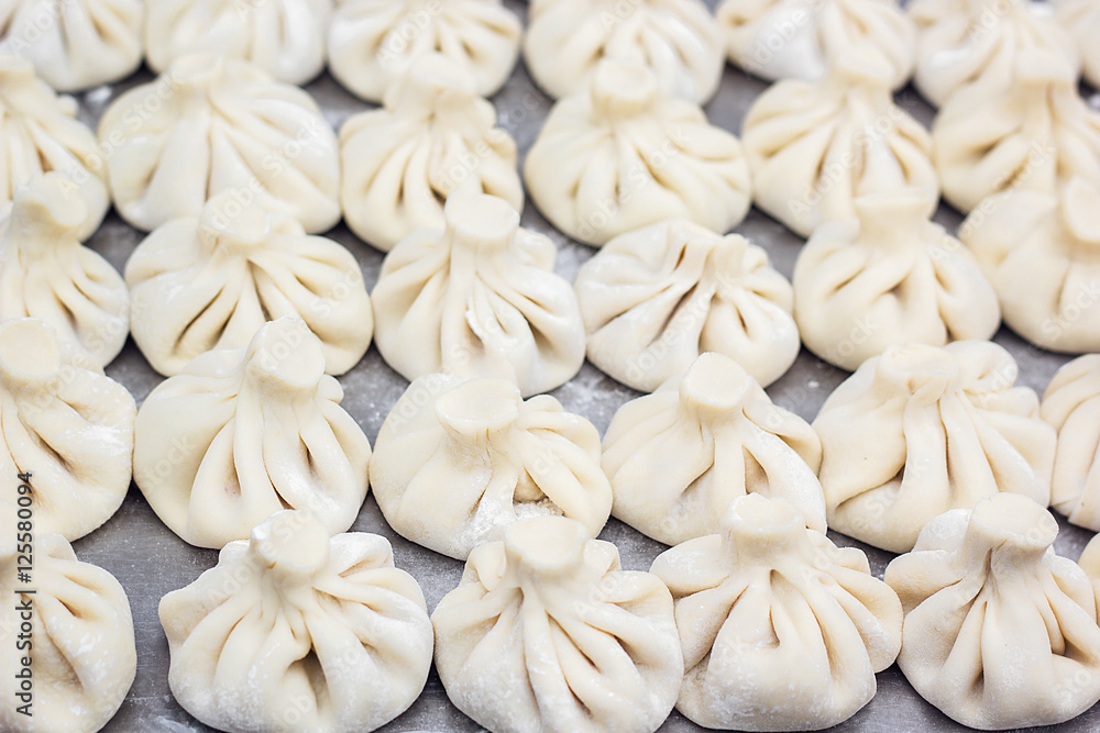 National Georgian cuisine Khinkali metal background Cook prepares khinkali kitchen Top view raw meat dough dish uncooked Street food booth selling Chinese specialty Steamed Dumplings Process cooking National Georgian cuisine Khinkali metal background Cook prepares khinkali kitchen Top view raw meat dough dish uncooked Street food booth selling Chinese specialty Steamed Dumplings Process cooking