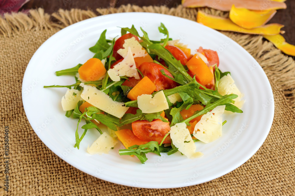 Dietary salad with pumpkin, fresh tomatoes, arugula and Parmesan. Dietary salad with pumpkin, fresh tomatoes, arugula and Parmesan.
