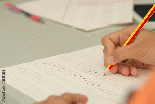 Thai student testing in exercise, exams answer sheets with penci photo