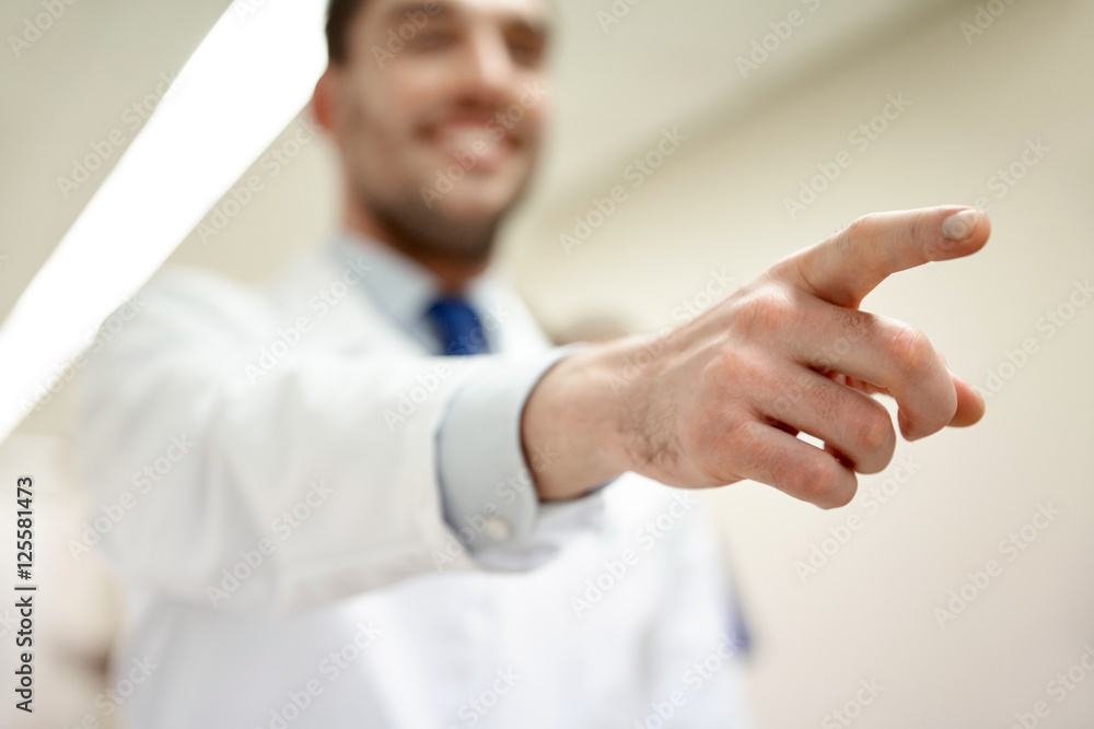 close up of doctor pointing finger at hospital close up of doctor pointing finger at hospital