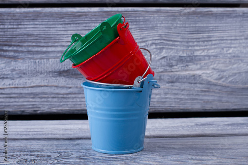 Small decorative colorful buckets. © margostock