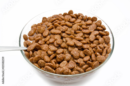 Chocolate cereal balls this milk in the bowl