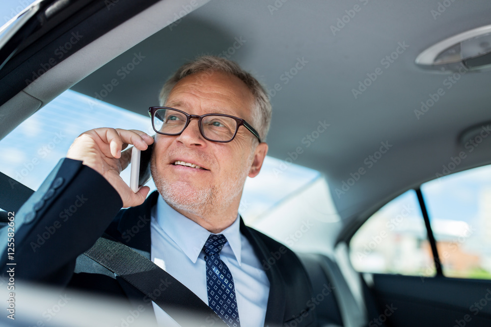 senior businessman calling on smartphone in car senior businessman calling on smartphone in car
