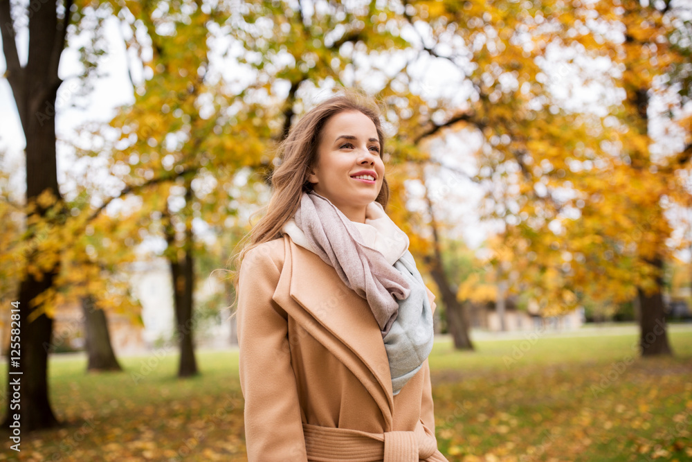 beautiful happy young woman walking in autumn park beautiful happy young woman walking in autumn park