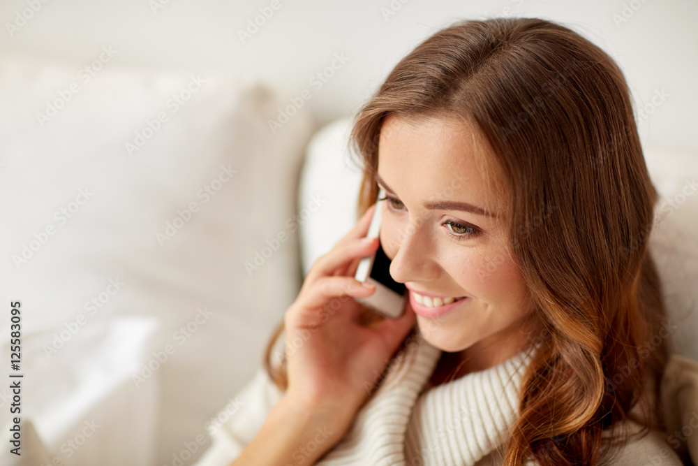 happy young woman calling on smartphone at home happy young woman calling on smartphone at home