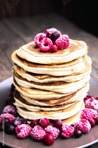 Close up pancake with berriesand honey