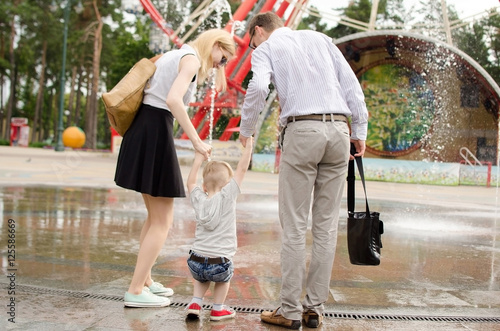 Young family is walking in the park