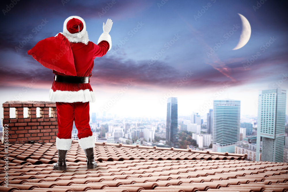 Fototapeta premium santa claus on roof 
