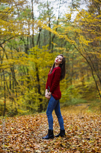 Beautiful woman in autumn park © czamfir