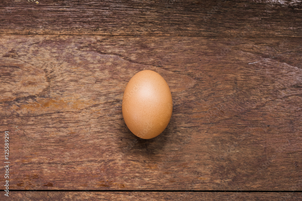 Egg on wood table Egg on wood table