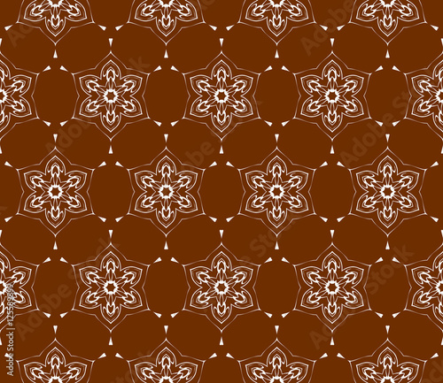 Abstract geometric flower on brown background. Seamless geometry pattern. Ethnic ornament.