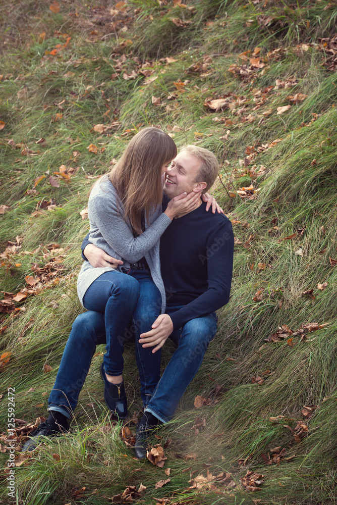 Young couple embracing in autumn park