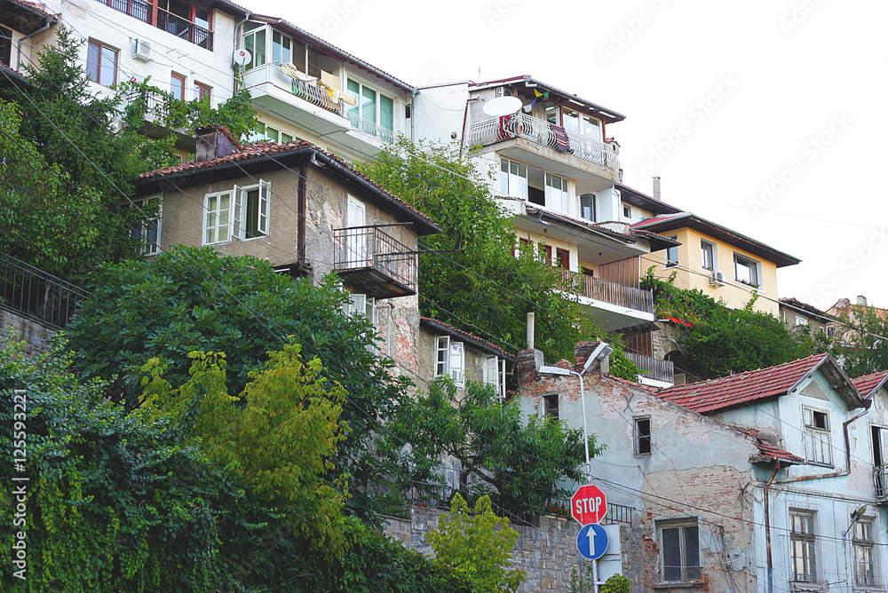 Buildings stand on the mountains