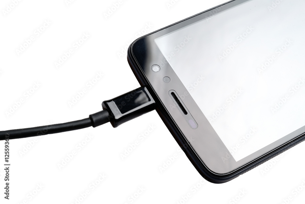 USB cable plug in to smartphone StockFoto Adobe Stock