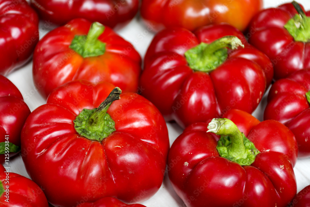 Fresh sweet red bell peppers isolated on a white background Fresh sweet red bell peppers isolated on a white background